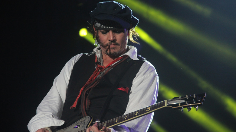 Johnny Depp playing the guitar
