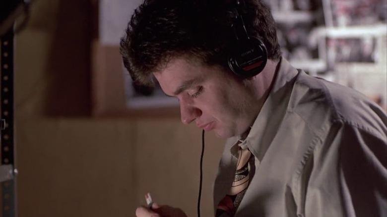 Oliver Platt wearing headphones