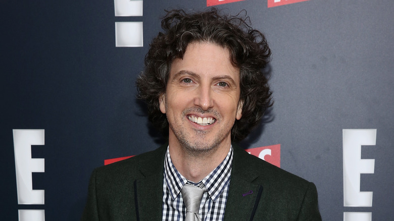 Mark Schwahn smiling on red carpet