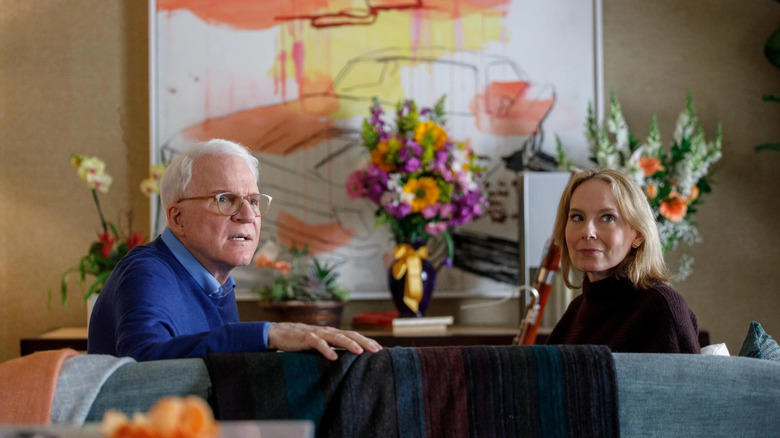 Steve Martin looking shocked next to a smirking Amy Ryan