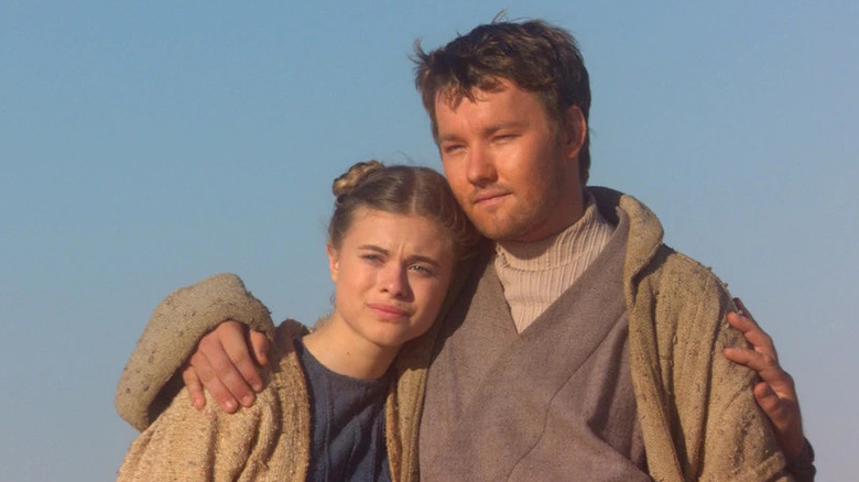 Young Owen hugs young Beru