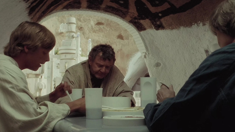 Owen, Luke, and Beru sit for a meal