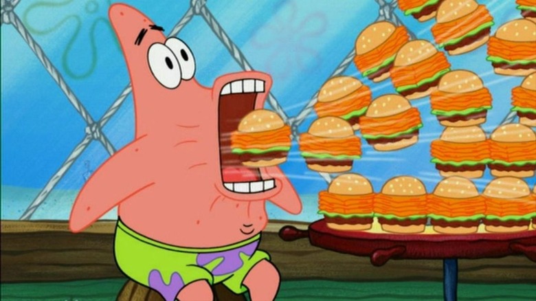 Patrick eating burgers