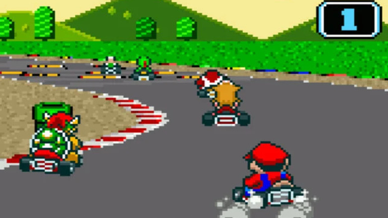 cars racing Mario Kart track