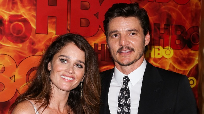 Robin Tunney and Pedro Pascal posing for pictures