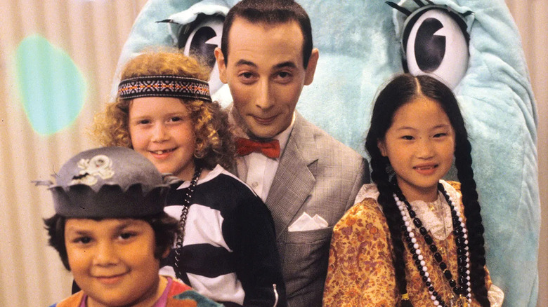 Pee-Wee and the Playhouse Gang sit on Chairy