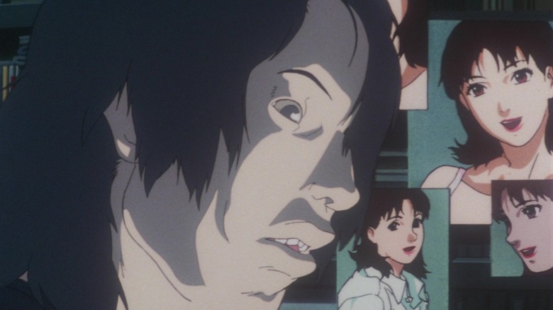 Mamoru Uchida surrounded by photos of Mima