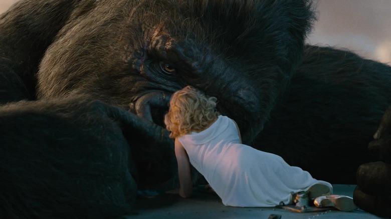 King Kong gazing tenderly at a woman 