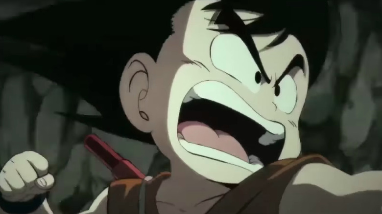 Goku yells with his fist pulled back