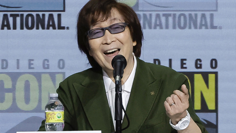 Toshio Furukawa speaks into a microphone at the San Diego Comicon