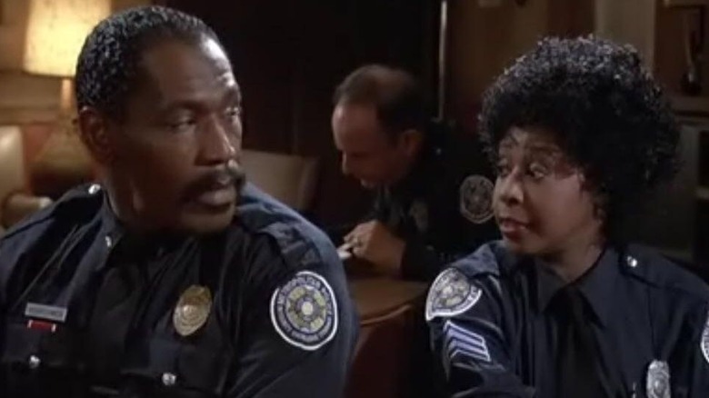 Bubba Smith and Marion Ramsay in Police Academy