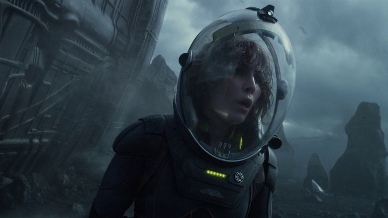 Noomi Rapace examining the terrain