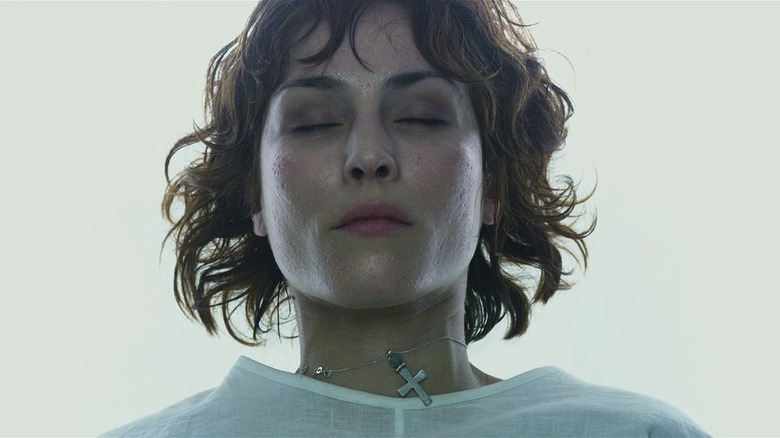 Noomi Rapace on operating table