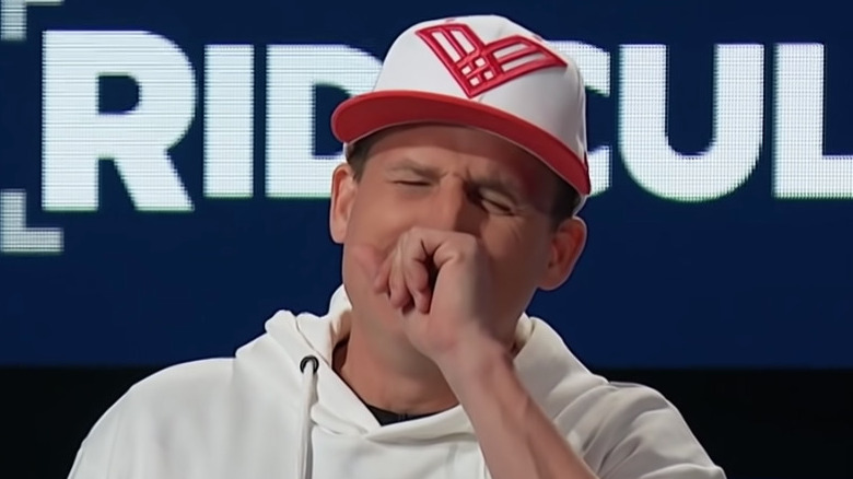 Rob Dyrdek hand over mouth