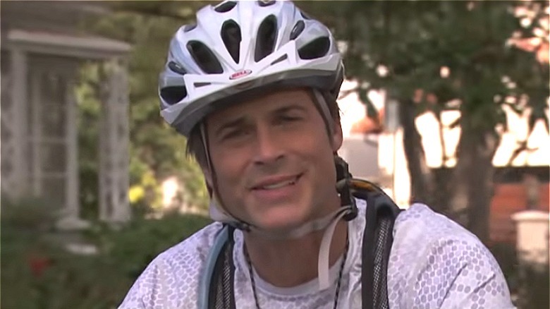 Rob Lowe wearing bike helmet