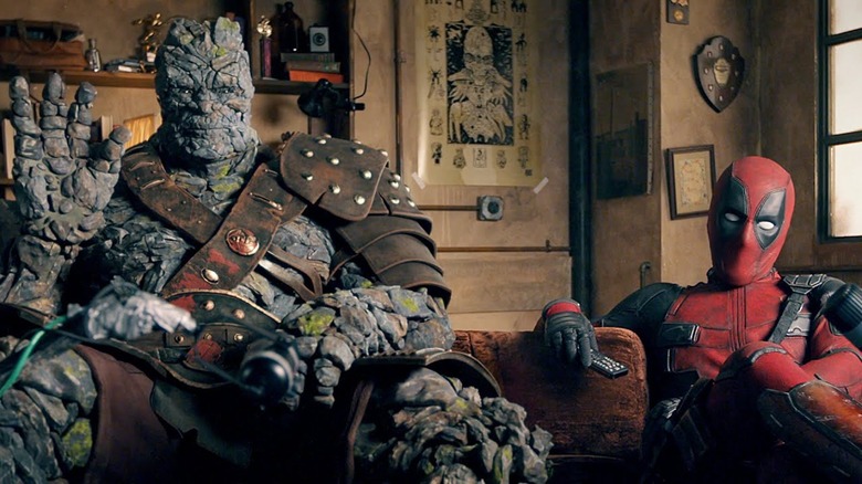 Korg and Deadpool sitting on a couch