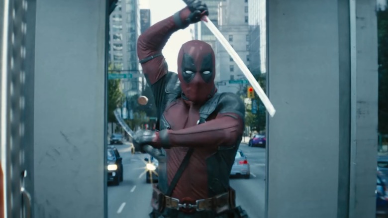 Deadpool fighting a bullet with his swords