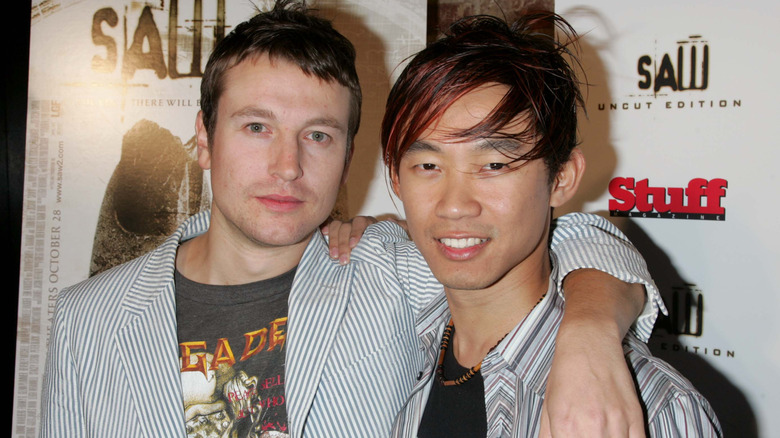 Young Leigh Whannell and James Wan posing