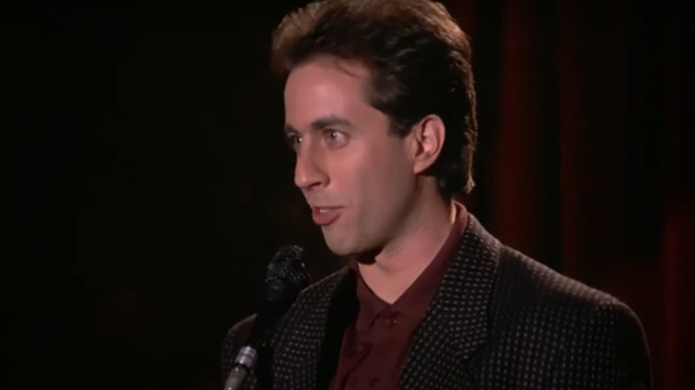 Jerry Seinfeld speaking into mic