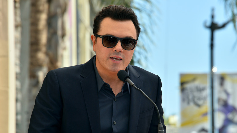 Seth MacFarlane speaking at an outdoor event in Los Angeles