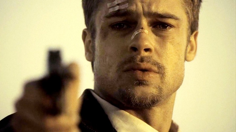 Brad Pitt points gun at Doe