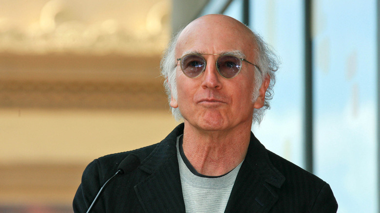 Larry David smirking