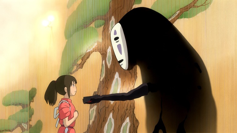 No-Face holding out hands to Chihiro 