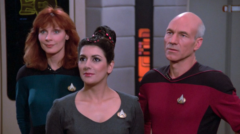 Crusher, Troi, and Picard look up