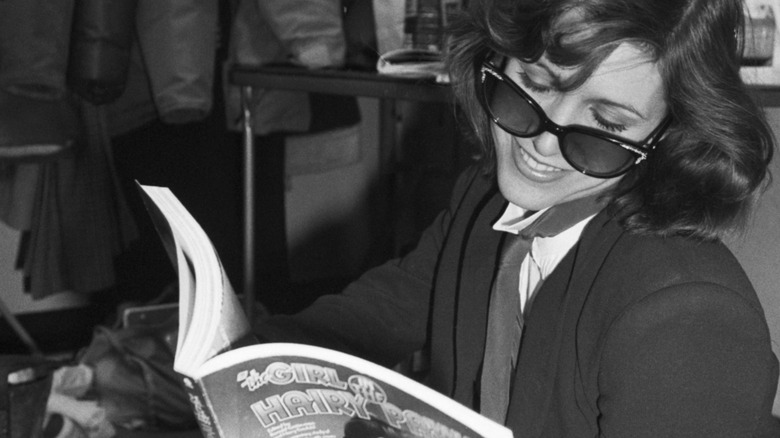 Carrie Fisher reading a book