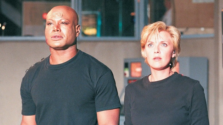 Teal'c and Samantha Carter gazing at light 