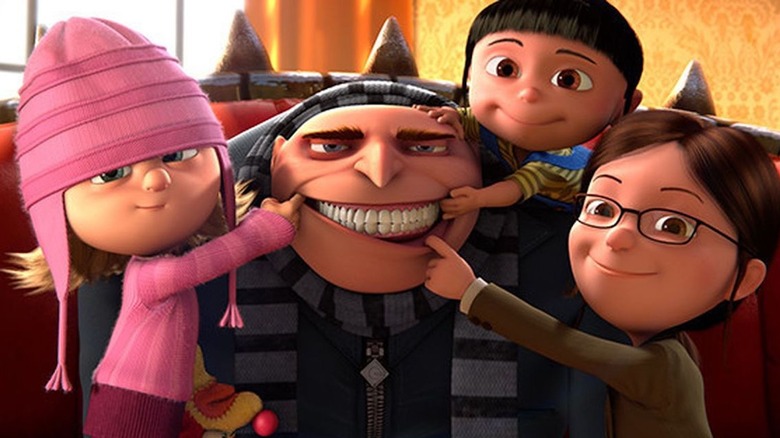 3 girls making Gru smile