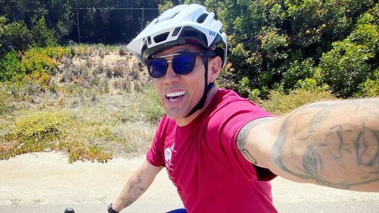 Steve-O selfie while riding his bike 