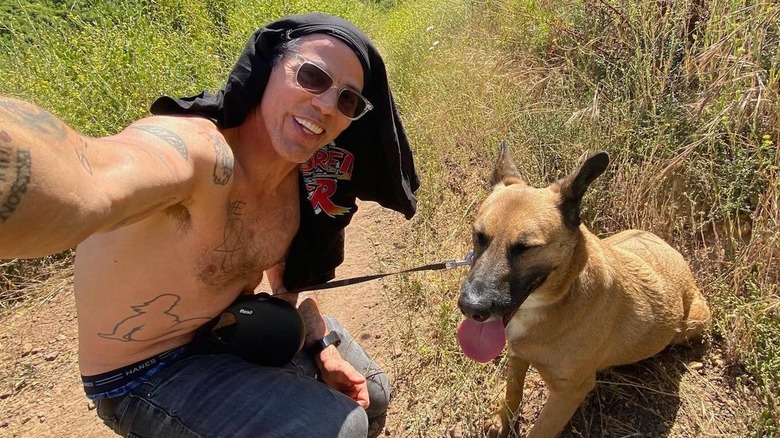 Steve-O shirtless selfie with his dog