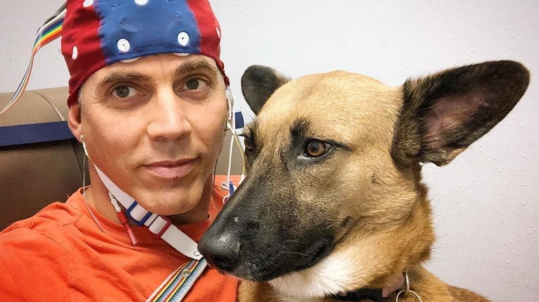 Steve-O brain scan hat with dog