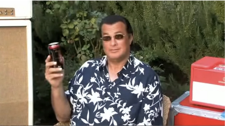 Steven Seagal holding a beer