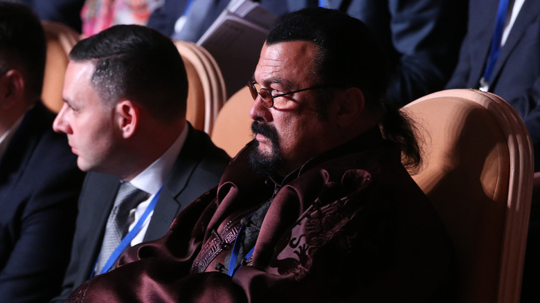 Steven Seagal looking stern in theater seat