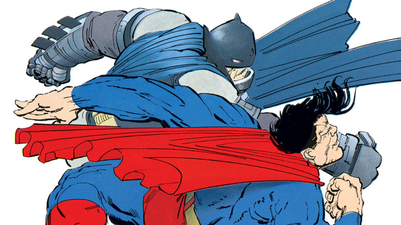 An armored Batman lands a punch against Superman in Batman: The Dark Knight Returns #4.