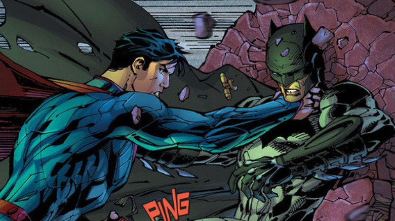 Superman pushes Batman through a wall in Justice League #2 by Geoff Johns and Jim Lee.