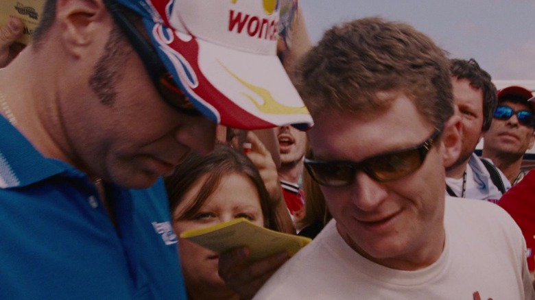 Ricky Bobby signs autograph for Dale Earnhardt Jr.