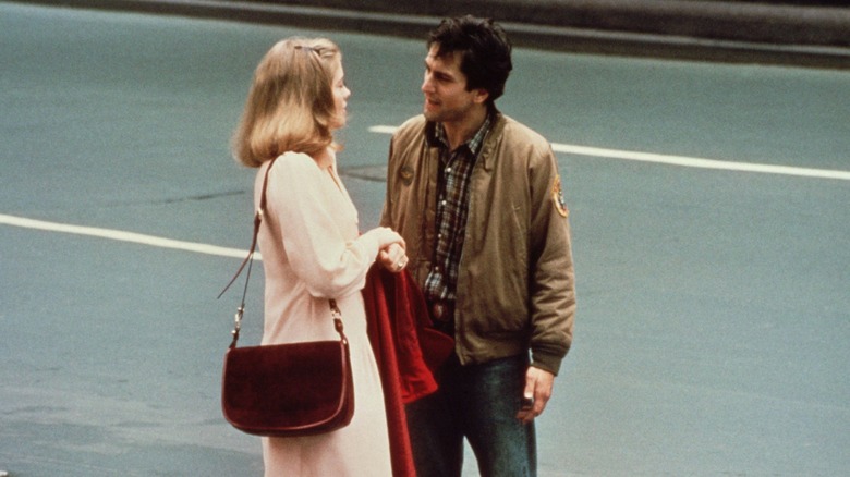 Robert De Niro talking to Cybil Shepherd in the street 