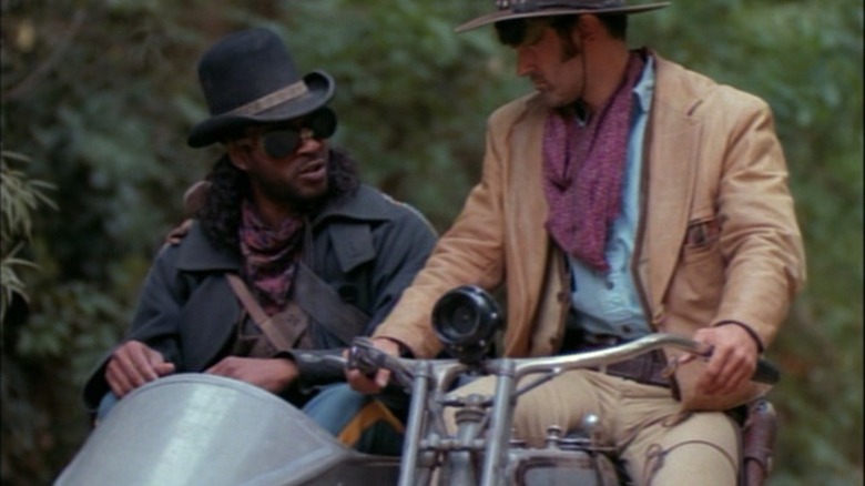 Brisco and Lord Bowler ride a steel horse