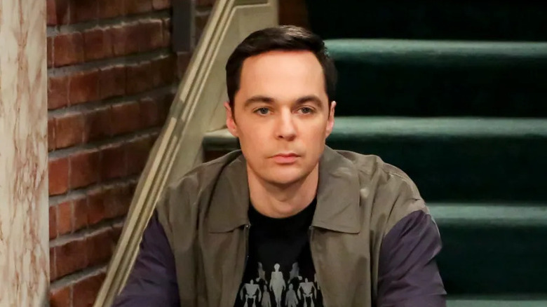 Jim Parsons sitting on stairs