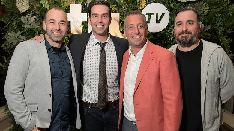 Michael Carbonaro and Impractical Jokers posing