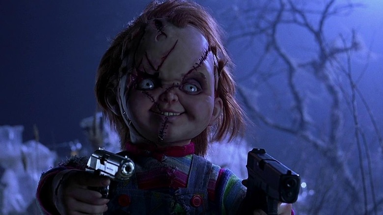 Chucky brandishing two guns