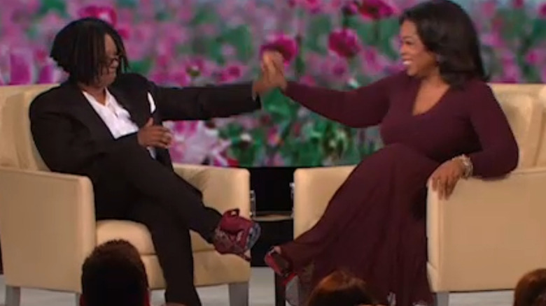 Oprah and Whoopi hold hands on talk show
