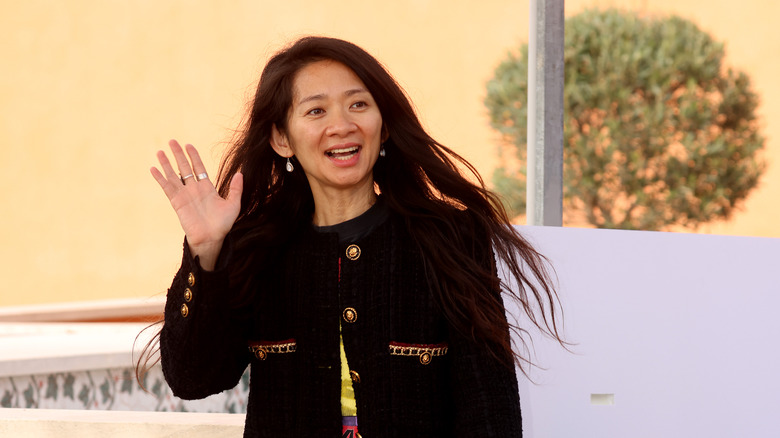 Chloe Zhao waving to fans