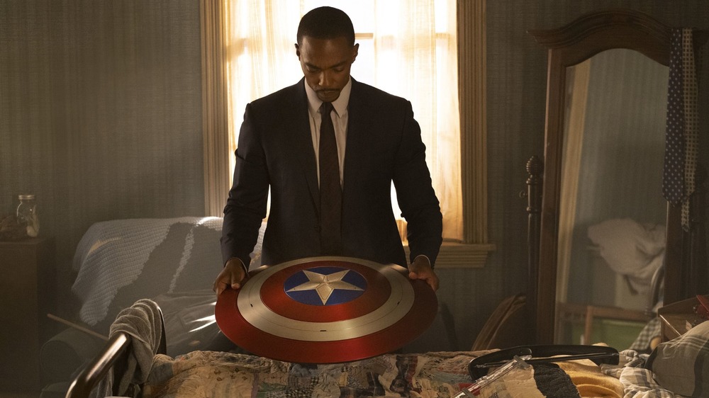 The Falcon holds Captain America's shield