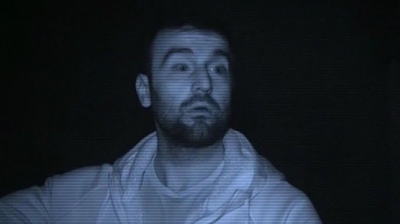 A "ghost hunter" being scared