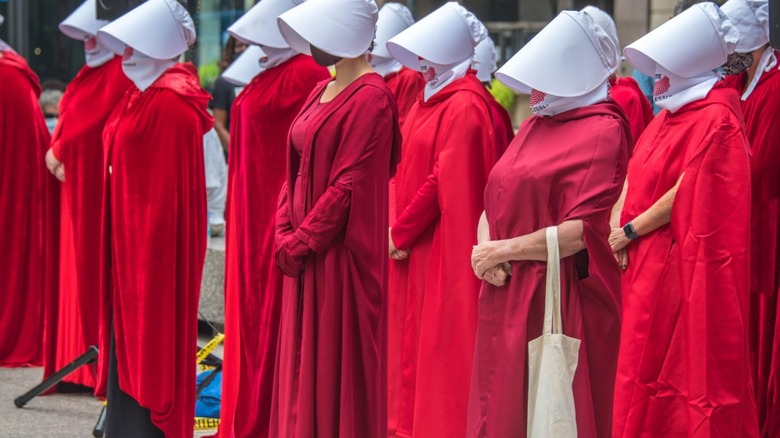 Handmaids await instruction