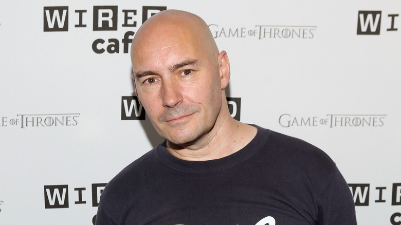 Grant Morrison posing for a photo